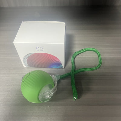 Gray intelligent automatic cat teasing ball with a clear section and braided cord, next to its white product box. - Image 15