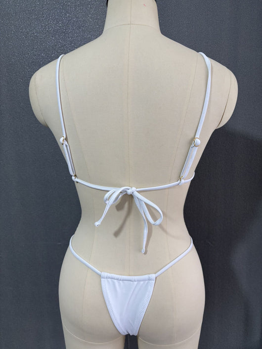White three-point bikini with gold chain straps on a mannequin, featuring a triangle top and thong bottom. - Image 22