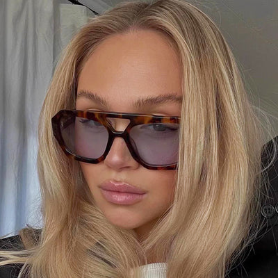 Minimalist square fashion sunglasses with a tortoiseshell frame and light brown lenses, angled view. - Image 33