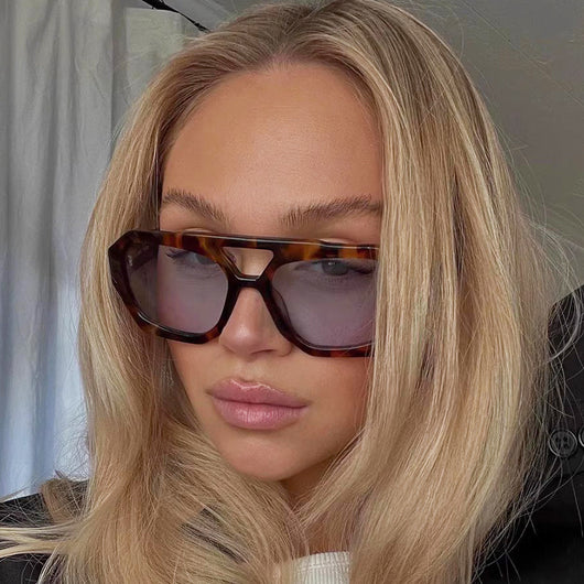 Minimalist square fashion sunglasses with a tortoiseshell frame and light brown lenses, angled view. - Image 33