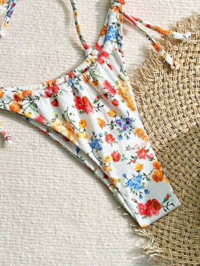 Women's white floral two-piece bikini with red, orange, and blue flowers, featuring a tie-front top and tie-side bottoms. - Image 18