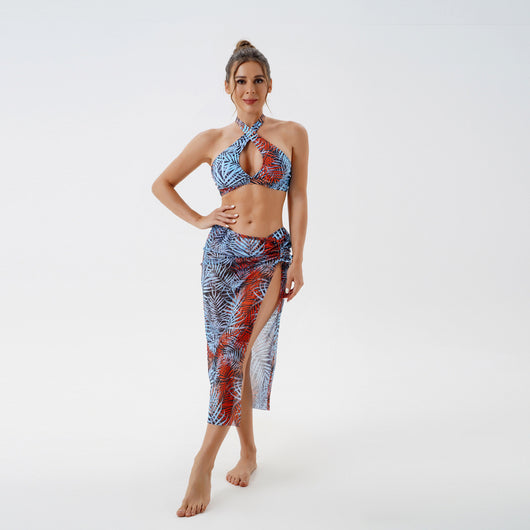 Women's plus size split swimsuit with a blue and green tropical leaf print halter bikini top and matching sarong skirt. - Image 28