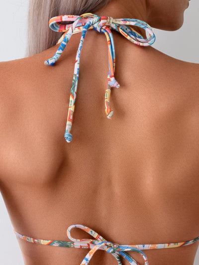 Women's colorful printed bikini swimsuit with a tropical and architectural design, featuring a halter triangle top and high-cut bottom. - Image 18