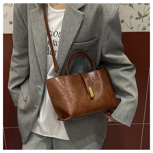 Bolso Bucket de Cuero Encerado Elegante y Portátil - Image 19