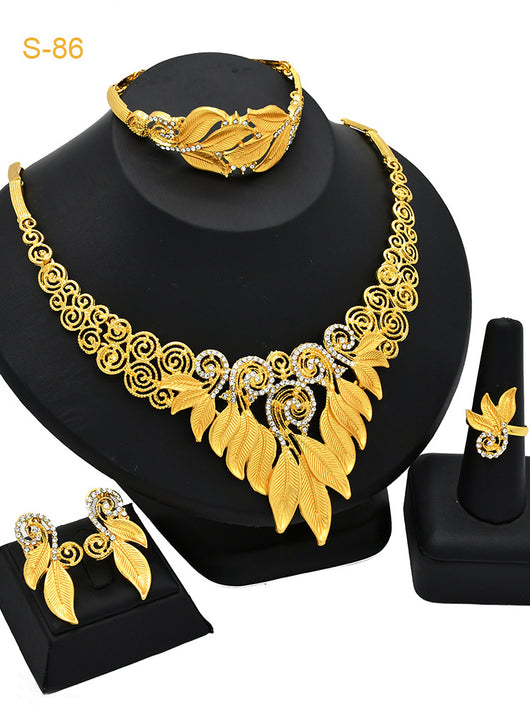 Women's Saudi bridal four-piece gold-colored jewelry set with floral and leaf designs, featuring a necklace, bracelet, earrings, and ring. - Image 16