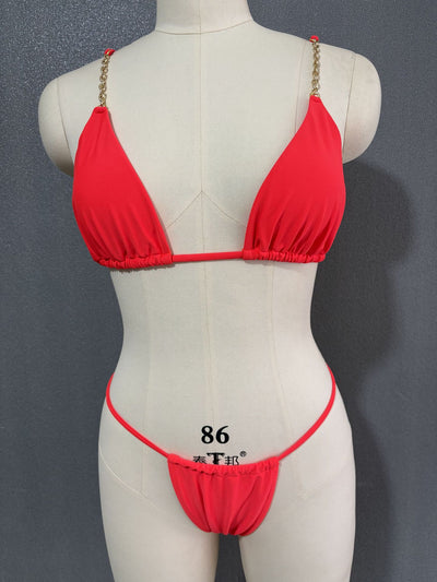 White three-point bikini with gold chain straps on a mannequin, featuring a triangle top and thong bottom. - Image 24