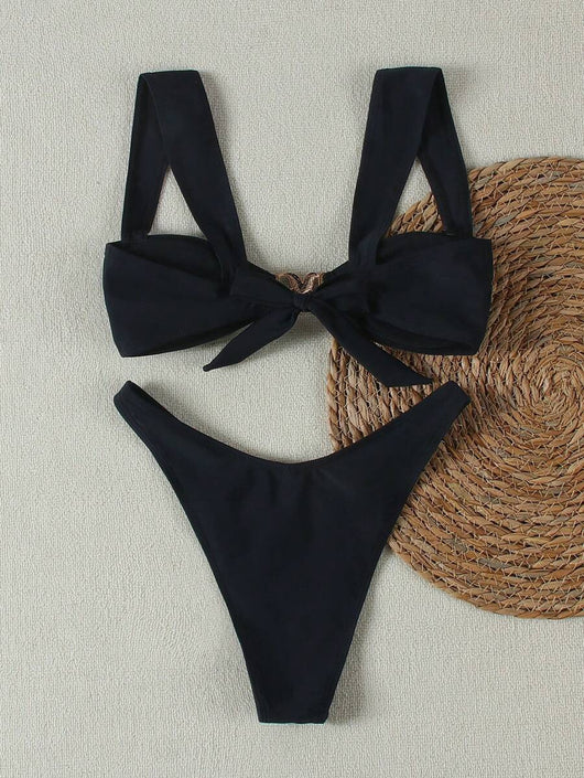 Bright yellow bikini with wide shoulder straps and a gold metal decoration on the top, worn by a woman. - Image 26