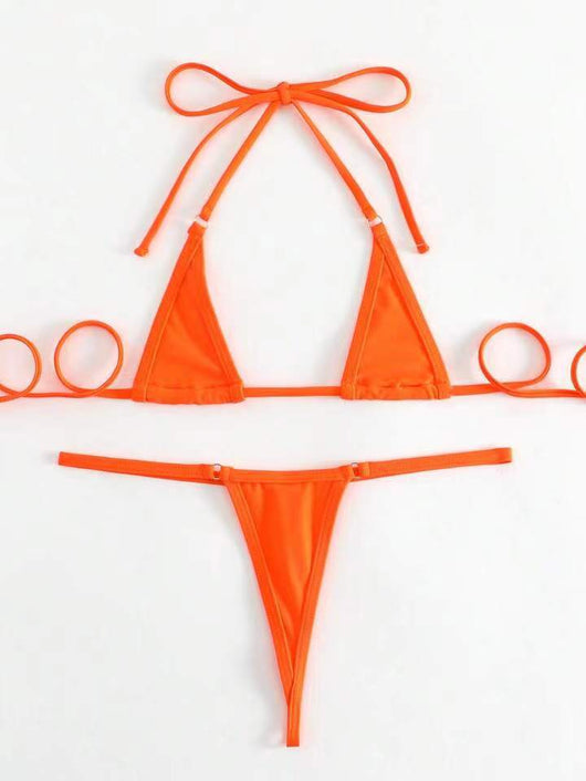 Orange solid color three-point bikini with a micro triangle top and thong bottom, modeled on a woman. - Image 27