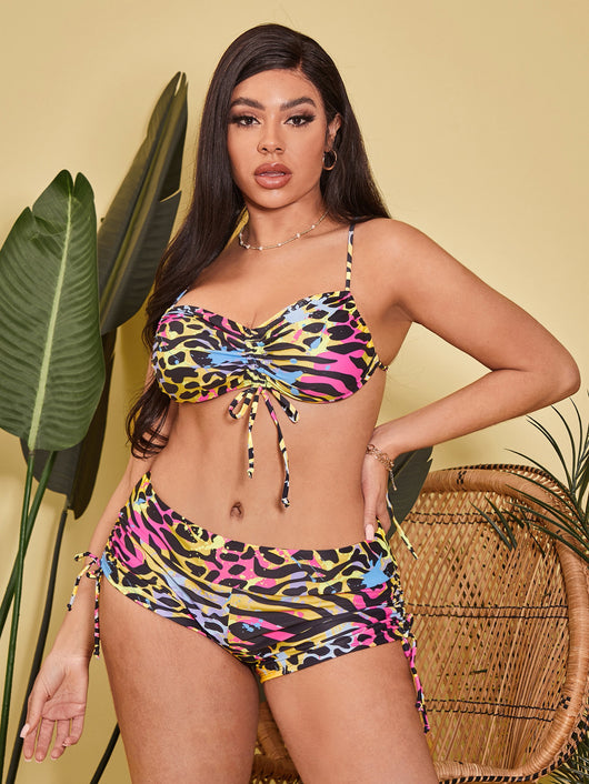 Plus-sized bikini swimsuit with vibrant multi-colored animal print, pleating, and drawstring details. - Image 9