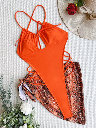 Women's neon green one-piece swimsuit with a tie-front halter neck and side cut-outs, paired with a matching snake print sarong. - Image 35