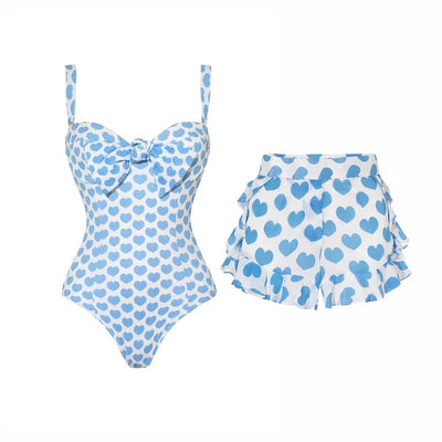 White shorts with blue heart print and ruffled sides, perfect for a fun vacation or casual summer day. - Image 25