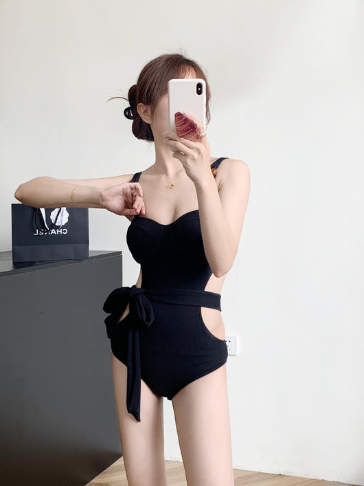 Black ribbed one-piece swimsuit with sweetheart neckline, chain-link shoulder strap, side cut-outs, and self-tie waist. - Image 19
