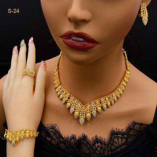 Women's Saudi bridal four-piece gold-colored jewelry set with floral and leaf designs, featuring a necklace, bracelet, earrings, and ring. - Image 12