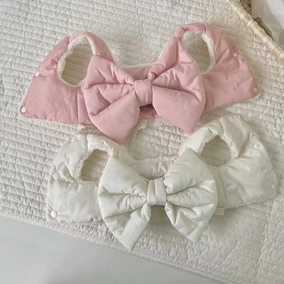 Creamy-white plush dog harness with a large decorative bow on the back, worn by a small poodle-like dog. - Image 8