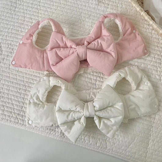 Creamy-white plush dog harness with a large decorative bow on the back, worn by a small poodle-like dog. - Image 8