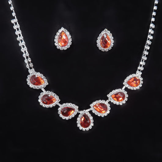 Purple teardrop rhinestone necklace and matching stud earrings set on a black background. - Image 20