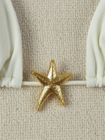 White women's bikini with triangle top and tie-side bottom, featuring a gold starfish charm on the center front. - Image 34