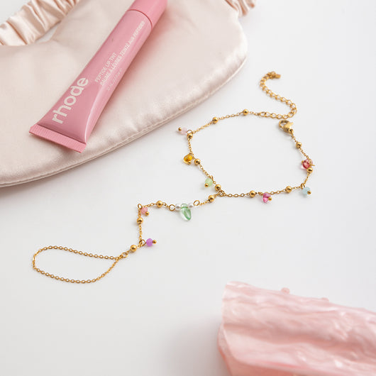 Gold-colored bracelet with a chain of small, interconnected heart-shaped links, featuring a lobster clasp and extender. - Image 18