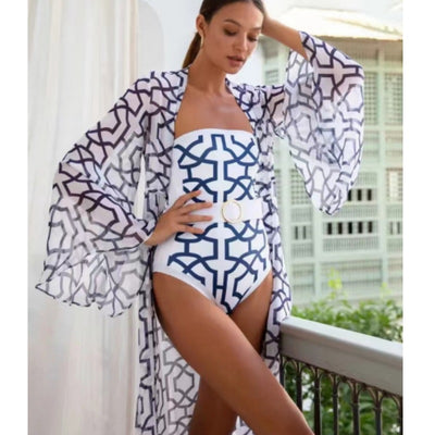 Woman in black and white floral print one-piece swimsuit with matching long-sleeved kimono cover-up and white belt. - Image 16