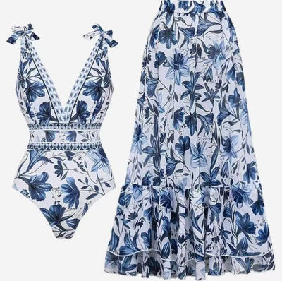 Women's white one-piece swimsuit with deep V-neck, blue floral and geometric patterns, and tie-shoulder straps. - Image 14