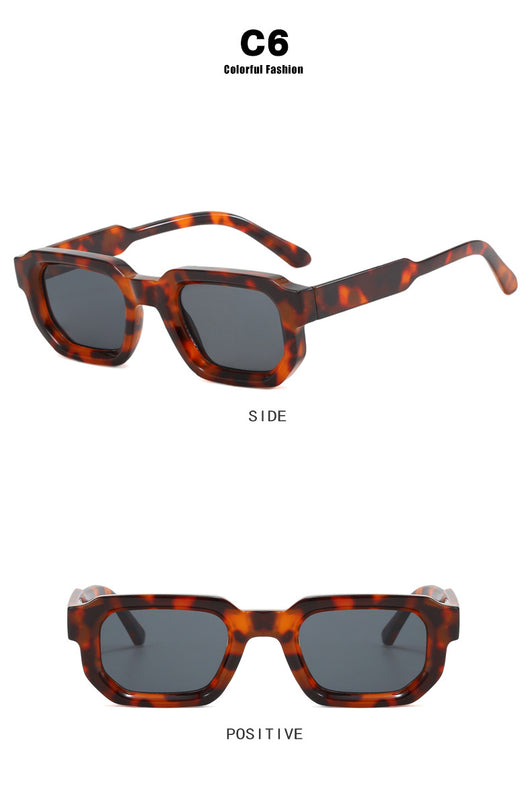Black square-frame sunglasses with thick, angular frames and dark blue lenses, shown on a white background. - Image 44