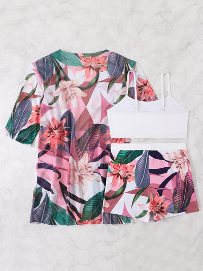 Woman in a three-piece bikini swimsuit set with a black tube top, floral boy shorts, and a sheer floral kimono cover-up. - Image 52