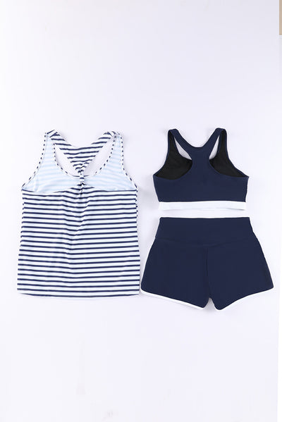 Women's navy blue three-piece high elastic bikini suit with racerback tankini top and swim shorts with white trim. - Image 41