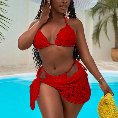 Red three-piece bikini set with a halter top, tie-side thong bottom, and sarong, all featuring a raised floral pattern. - Image 34