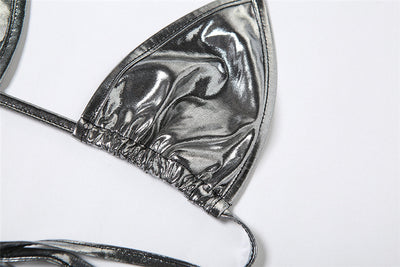 Purple reflective two-piece bikini with a halter neck top and tie-side bottoms, featuring a shiny solid color fabric. - Image 27