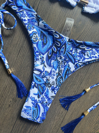 Women's blue and white porcelain print halter bikini with tie-side bottoms and blue tassels. - Image 26