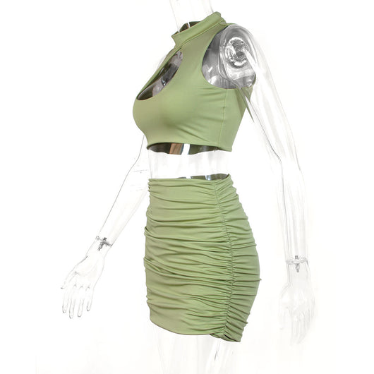 Light green two-piece set featuring a sleeveless crop top with a high neck and chest cutout, paired with a ruched bodycon mini skirt. - Image 15