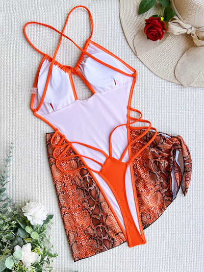 Women's neon green one-piece swimsuit with a tie-front halter neck and side cut-outs, paired with a matching snake print sarong. - Image 25
