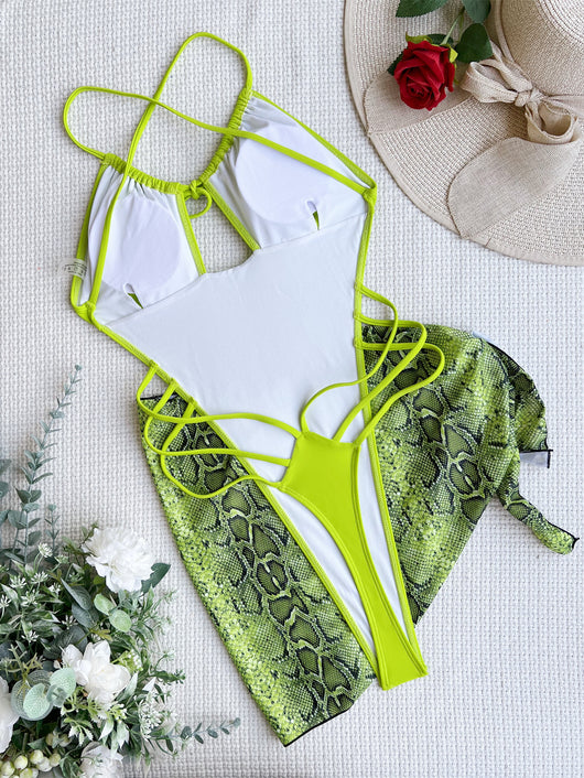 Women's neon green one-piece swimsuit with a tie-front halter neck and side cut-outs, paired with a matching snake print sarong. - Image 43