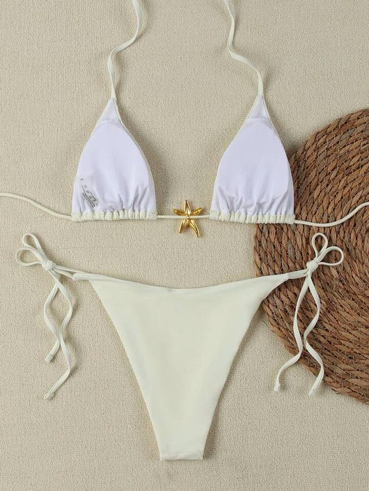 White women's bikini with triangle top and tie-side bottom, featuring a gold starfish charm on the center front. - Image 36