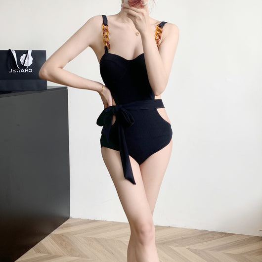 Black ribbed one-piece swimsuit with sweetheart neckline, chain-link shoulder strap, side cut-outs, and self-tie waist. - Image 15