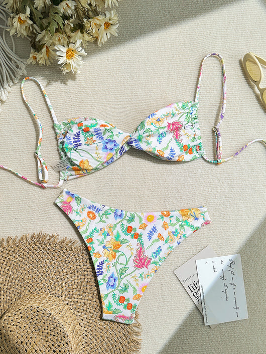 White ribbed two-piece bikini with colorful floral print, featuring a bandeau top and high-cut bottom. - Image 14