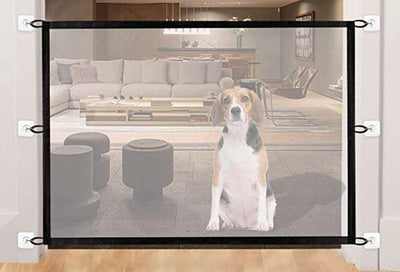 Black mesh pet gate installed at the bottom of a wooden staircase, with a golden retriever sitting in front. - Image 20