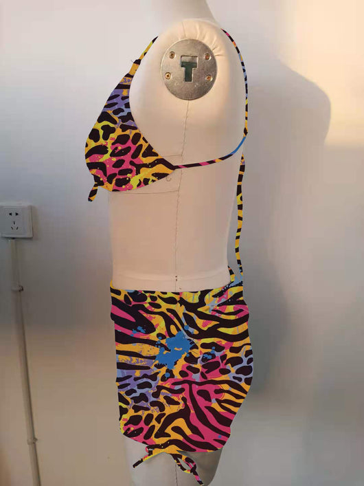 Plus-sized bikini swimsuit with vibrant multi-colored animal print, pleating, and drawstring details. - Image 17