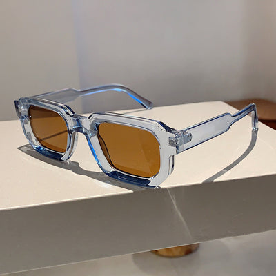 Black square-frame sunglasses with thick, angular frames and dark blue lenses, shown on a white background. - Image 32