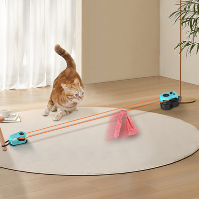 Blue and black cat weight loss remote control sound toy with string and feather, shown with a tabby cat playing. - Image 11
