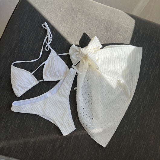 White textured bikini with ruched triangle top, high-cut bottom, and matching sarong with a large bow. - Image 29