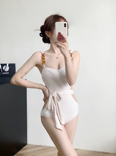 Black ribbed one-piece swimsuit with sweetheart neckline, chain-link shoulder strap, side cut-outs, and self-tie waist. - Image 11
