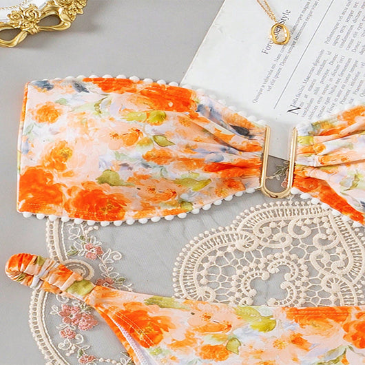 Orange floral print bandeau bikini with pom-pom trim and high-cut thong bottom with side rings. - Image 15