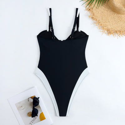 White one-piece women's swimsuit with black side panels and straps, featuring a ruched bust and U-shaped detail. - Image 32