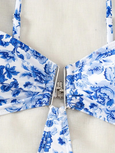 Blue and white floral one-piece swimsuit with a V-bar detail and side cut-outs, perfect for summer. - Image 13