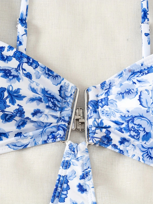Blue and white floral one-piece swimsuit with a V-bar detail and side cut-outs, perfect for summer. - Image 13