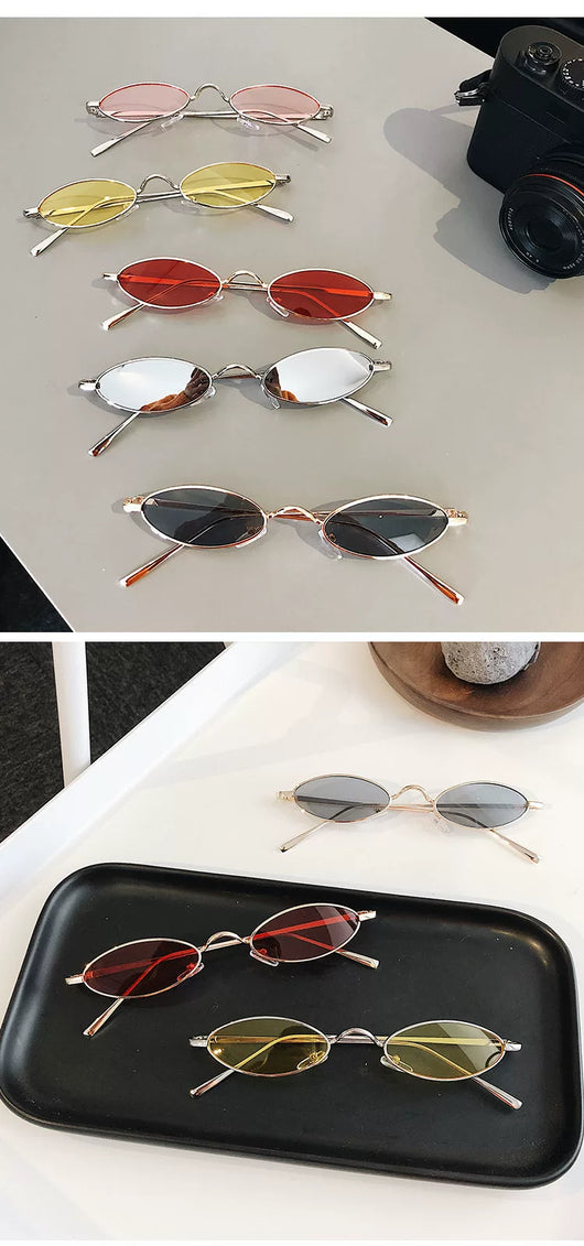 Silver-framed oval sunglasses with dark lenses reflecting a warm-toned object, displayed on a white tray. - Image 10