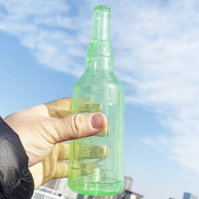 Translucent blue pet molar toy shaped like a bottle, featuring embossed paw prints and the word "DOG". - Image 8