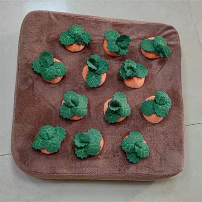 Brown plush snuffle mat with ten orange carrot-shaped toys, each with green leafy tops, for pet foraging and play. - Image 20