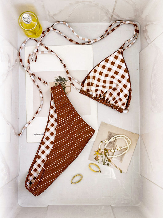 Retro brown and white plaid triangle bikini top with matching polka-dot bottoms, displayed flat with accessories. - Image 6